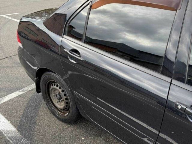 Чорний Міцубісі Lancer, об'ємом двигуна 1.6 л та пробігом 245 тис. км за 4500 $, фото 5 на Automoto.ua