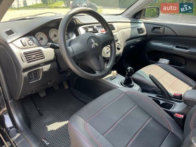 Чорний Міцубісі Lancer, об'ємом двигуна 1.6 л та пробігом 296 тис. км за 4200 $, фото 32 на Automoto.ua
