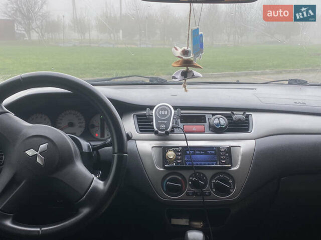 Черный Мицубиси Лансер, объемом двигателя 1.58 л и пробегом 211 тыс. км за 6333 $, фото 30 на Automoto.ua