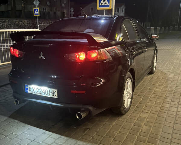 Черный Мицубиси Лансер, объемом двигателя 2 л и пробегом 270 тыс. км за 5400 $, фото 6 на Automoto.ua