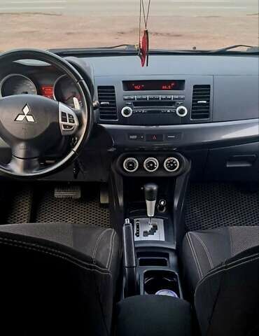 Черный Мицубиси Лансер, объемом двигателя 2 л и пробегом 211 тыс. км за 6900 $, фото 9 на Automoto.ua