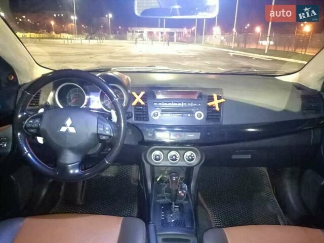 Черный Мицубиси Лансер, объемом двигателя 2 л и пробегом 240 тыс. км за 6400 $, фото 14 на Automoto.ua