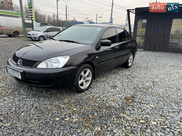 Черный Мицубиси Лансер, объемом двигателя 1.58 л и пробегом 202 тыс. км за 4100 $, фото 1 на Automoto.ua