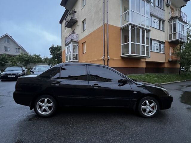 Черный Мицубиси Лансер, объемом двигателя 1.6 л и пробегом 270 тыс. км за 5000 $, фото 2 на Automoto.ua