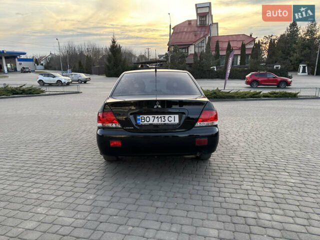 Чорний Міцубісі Lancer, об'ємом двигуна 1.58 л та пробігом 344 тис. км за 3999 $, фото 4 на Automoto.ua