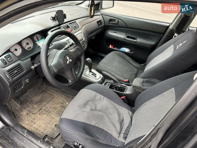 Чорний Міцубісі Lancer, об'ємом двигуна 1.58 л та пробігом 388 тис. км за 2300 $, фото 8 на Automoto.ua