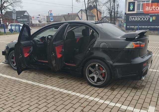 Чорний Міцубісі Lancer, об'ємом двигуна 2 л та пробігом 160 тис. км за 8000 $, фото 6 на Automoto.ua