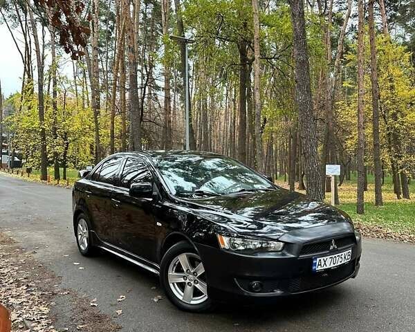 Черный Мицубиси Лансер, объемом двигателя 2 л и пробегом 216 тыс. км за 5600 $, фото 2 на Automoto.ua