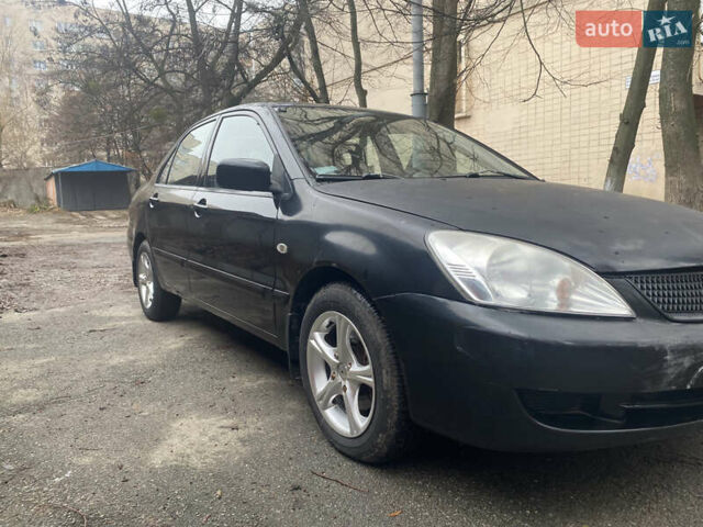 Черный Мицубиси Лансер, объемом двигателя 1.6 л и пробегом 143 тыс. км за 3000 $, фото 5 на Automoto.ua