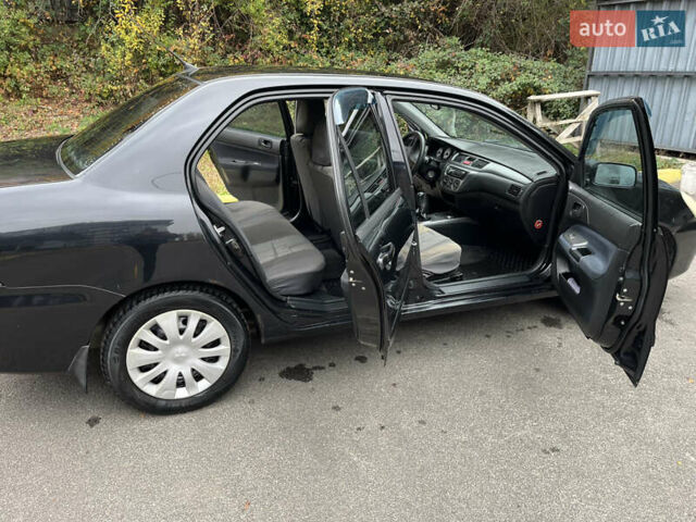 Чорний Міцубісі Lancer, об'ємом двигуна 1.58 л та пробігом 192 тис. км за 4500 $, фото 9 на Automoto.ua