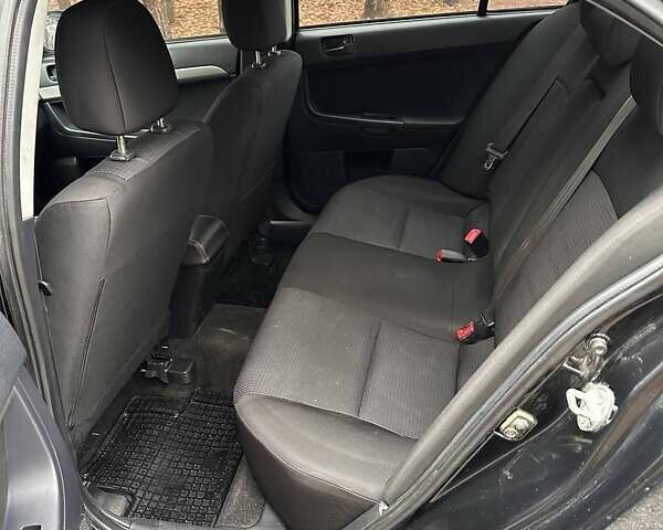 Чорний Міцубісі Lancer, об'ємом двигуна 2 л та пробігом 263 тис. км за 5750 $, фото 8 на Automoto.ua