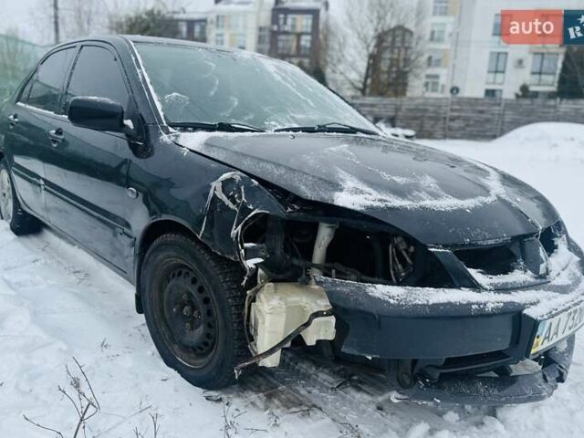 Черный Мицубиси Лансер, объемом двигателя 1.6 л и пробегом 179 тыс. км за 2700 $, фото 2 на Automoto.ua