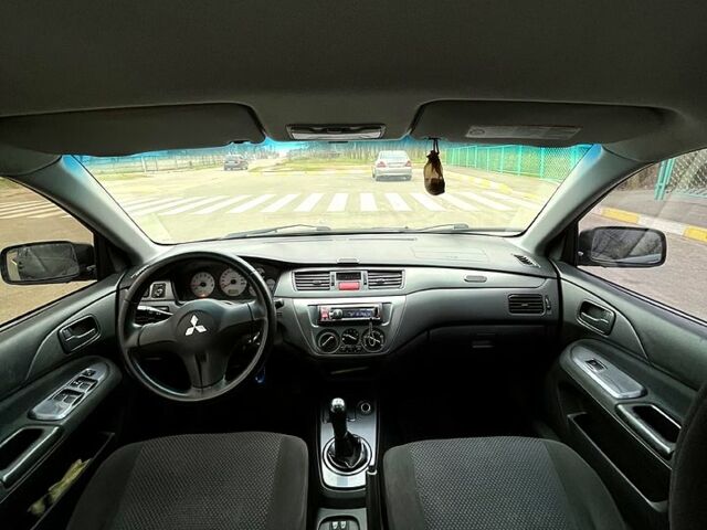 Чорний Міцубісі Lancer, об'ємом двигуна 1.6 л та пробігом 380 тис. км за 4350 $, фото 6 на Automoto.ua