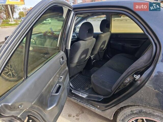 Черный Мицубиси Лансер, объемом двигателя 1.6 л и пробегом 358 тыс. км за 4300 $, фото 6 на Automoto.ua