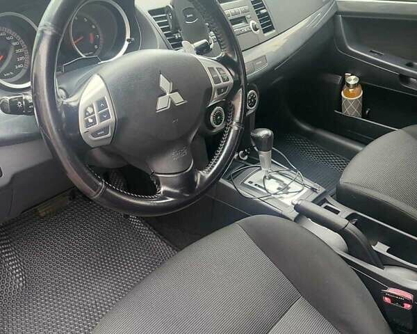 Черный Мицубиси Лансер, объемом двигателя 2 л и пробегом 229 тыс. км за 7300 $, фото 8 на Automoto.ua