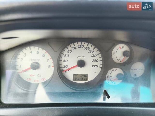 Черный Мицубиси Лансер, объемом двигателя 1.6 л и пробегом 358 тыс. км за 4300 $, фото 7 на Automoto.ua