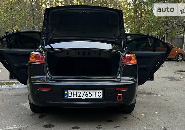 Чорний Міцубісі Lancer, об'ємом двигуна 2 л та пробігом 206 тис. км за 5600 $, фото 57 на Automoto.ua