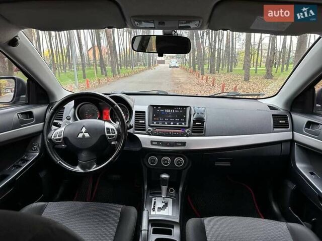 Черный Мицубиси Лансер, объемом двигателя 2 л и пробегом 216 тыс. км за 5600 $, фото 10 на Automoto.ua