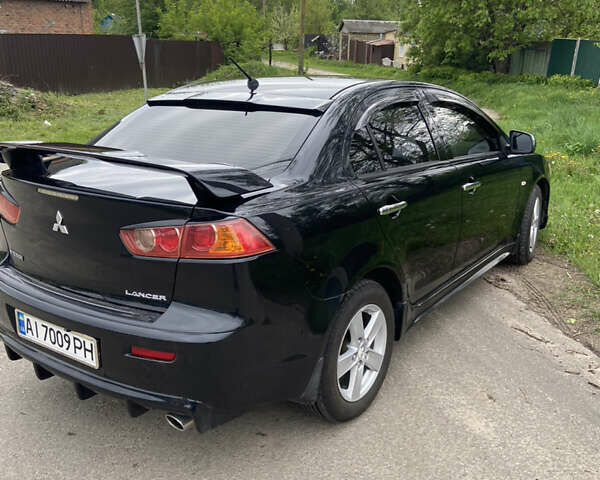 Чорний Міцубісі Lancer, об'ємом двигуна 2 л та пробігом 237 тис. км за 7599 $, фото 3 на Automoto.ua