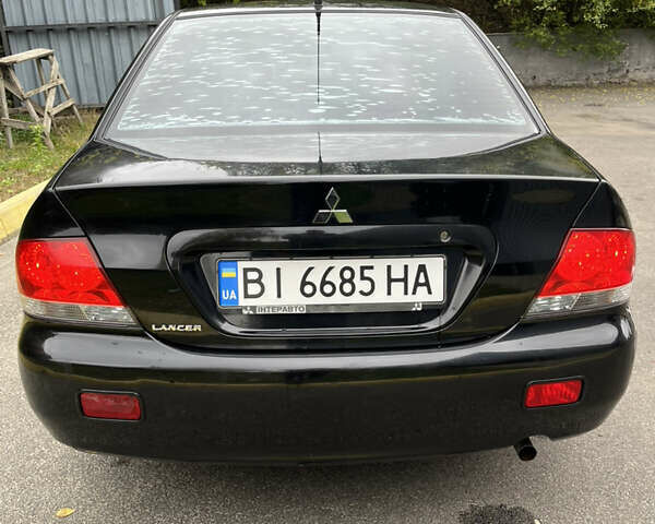 Чорний Міцубісі Lancer, об'ємом двигуна 1.58 л та пробігом 192 тис. км за 4500 $, фото 18 на Automoto.ua