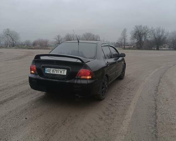 Чорний Міцубісі Lancer, об'ємом двигуна 1.58 л та пробігом 233 тис. км за 4800 $, фото 3 на Automoto.ua