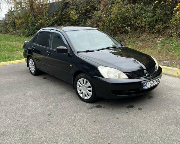 Чорний Міцубісі Lancer, об'ємом двигуна 1.58 л та пробігом 192 тис. км за 4500 $, фото 1 на Automoto.ua