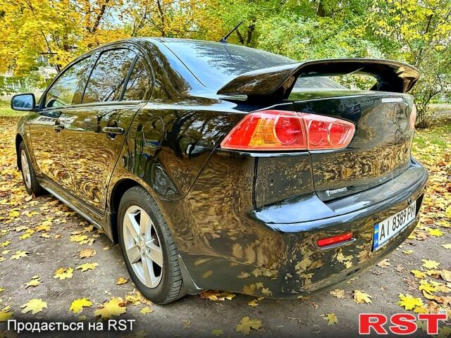 Чорний Міцубісі Lancer, об'ємом двигуна 2 л та пробігом 245 тис. км за 5500 $, фото 4 на Automoto.ua