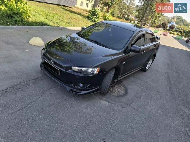 Черный Мицубиси Лансер, объемом двигателя 2 л и пробегом 230 тыс. км за 7000 $, фото 21 на Automoto.ua