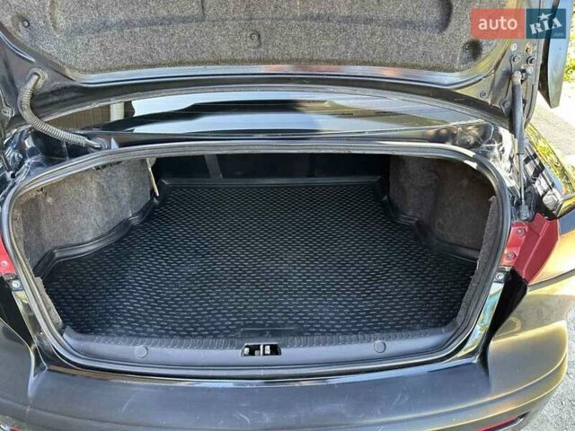 Черный Мицубиси Лансер, объемом двигателя 2 л и пробегом 230 тыс. км за 7000 $, фото 13 на Automoto.ua