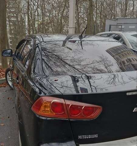 Чорний Міцубісі Lancer, об'ємом двигуна 2 л та пробігом 302 тис. км за 7200 $, фото 1 на Automoto.ua