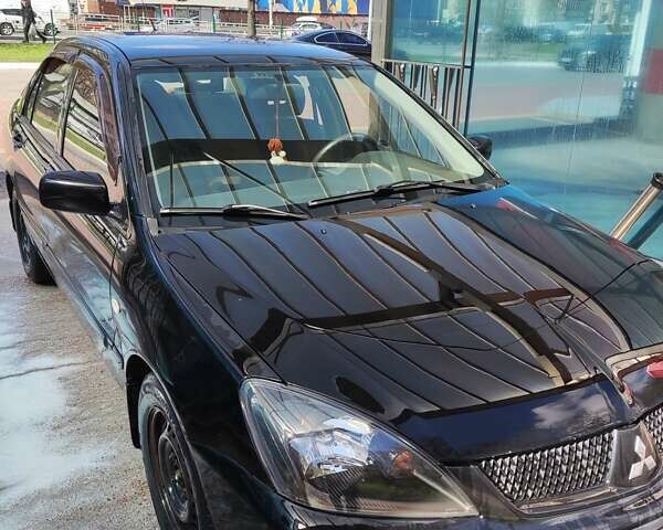 Чорний Міцубісі Lancer, об'ємом двигуна 1.58 л та пробігом 204 тис. км за 4700 $, фото 27 на Automoto.ua