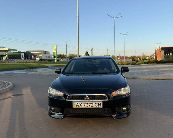 Черный Мицубиси Лансер, объемом двигателя 2 л и пробегом 136 тыс. км за 8300 $, фото 2 на Automoto.ua