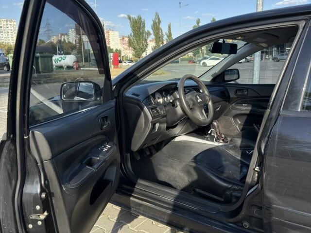 Чорний Міцубісі Lancer, об'ємом двигуна 1.6 л та пробігом 364 тис. км за 3000 $, фото 7 на Automoto.ua