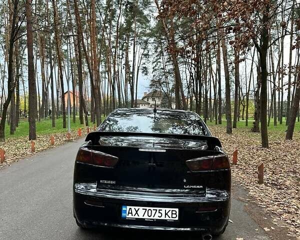 Черный Мицубиси Лансер, объемом двигателя 2 л и пробегом 216 тыс. км за 5600 $, фото 4 на Automoto.ua