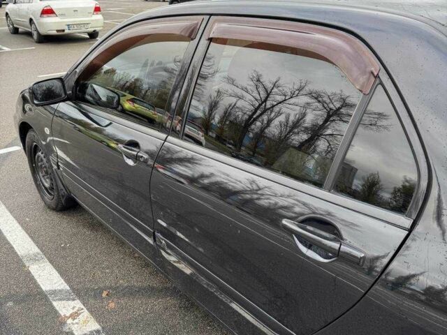 Чорний Міцубісі Lancer, об'ємом двигуна 1.6 л та пробігом 245 тис. км за 4500 $, фото 12 на Automoto.ua