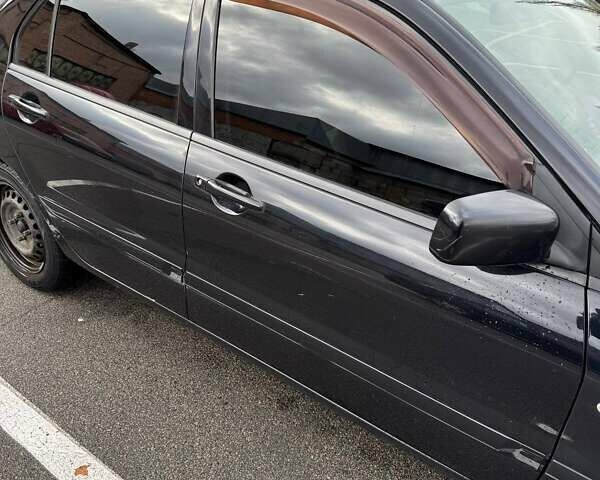 Чорний Міцубісі Lancer, об'ємом двигуна 1.6 л та пробігом 245 тис. км за 4500 $, фото 3 на Automoto.ua