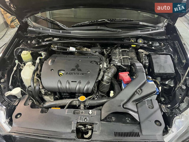 Черный Мицубиси Лансер, объемом двигателя 2 л и пробегом 200 тыс. км за 8000 $, фото 24 на Automoto.ua