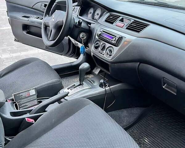 Чорний Міцубісі Lancer, об'ємом двигуна 1.6 л та пробігом 300 тис. км за 5500 $, фото 2 на Automoto.ua