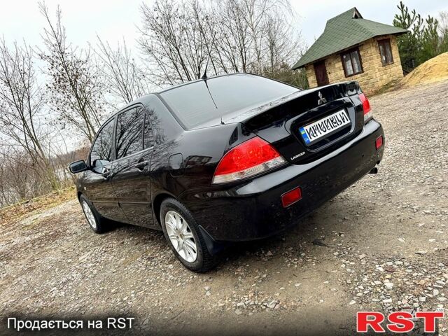 Черный Мицубиси Лансер, объемом двигателя 1.6 л и пробегом 216 тыс. км за 5190 $, фото 2 на Automoto.ua