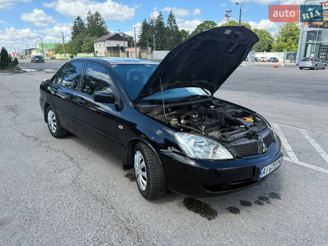 Чорний Міцубісі Lancer, об'ємом двигуна 1.6 л та пробігом 292 тис. км за 3600 $, фото 12 на Automoto.ua