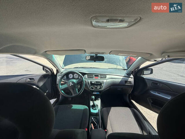 Чорний Міцубісі Lancer, об'ємом двигуна 1.6 л та пробігом 292 тис. км за 3600 $, фото 19 на Automoto.ua