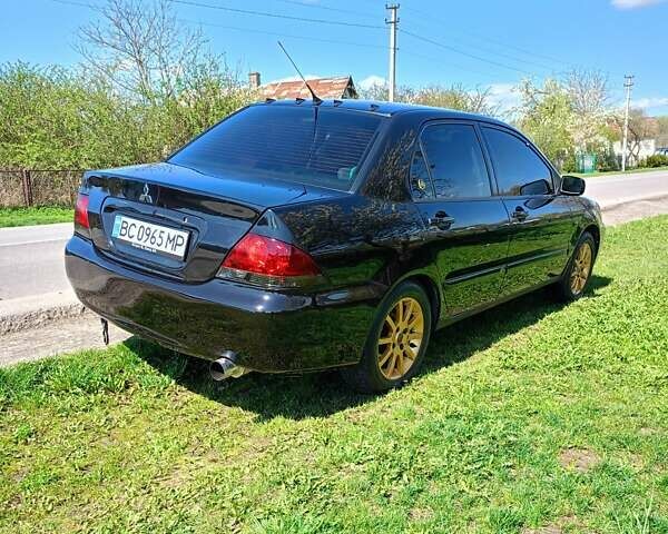 Мицубиси Лансер 2008 в Львове на Automoto.ua Черный Мицубиси Лансер, объемом двигателя 1.58 л и пробегом 200 тыс. км за 5200 $, фото 69 на Automoto.ua
