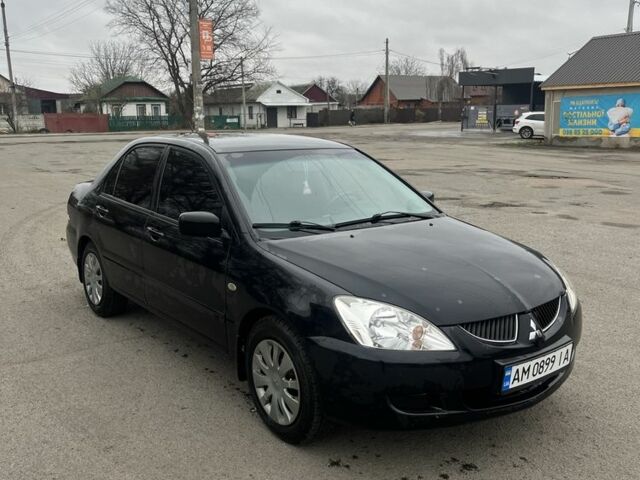 Черный Мицубиси Лансер, объемом двигателя 1.6 л и пробегом 1 тыс. км за 3750 $, фото 1 на Automoto.ua