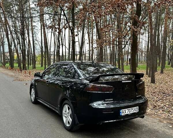 Черный Мицубиси Лансер, объемом двигателя 2 л и пробегом 216 тыс. км за 5600 $, фото 5 на Automoto.ua