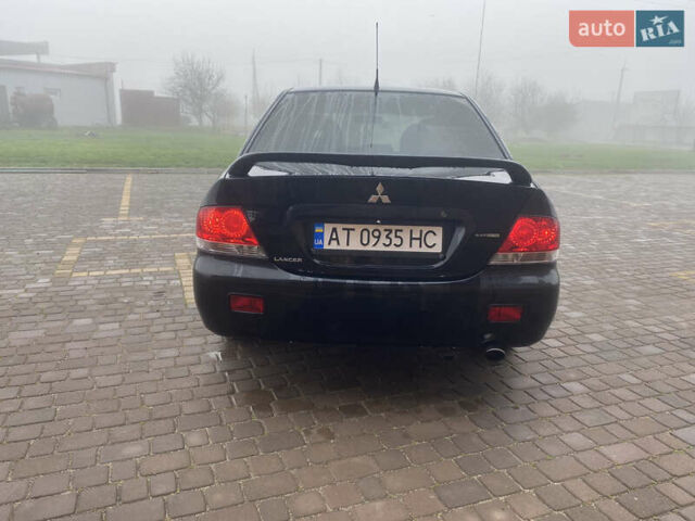 Черный Мицубиси Лансер, объемом двигателя 1.58 л и пробегом 211 тыс. км за 6333 $, фото 7 на Automoto.ua