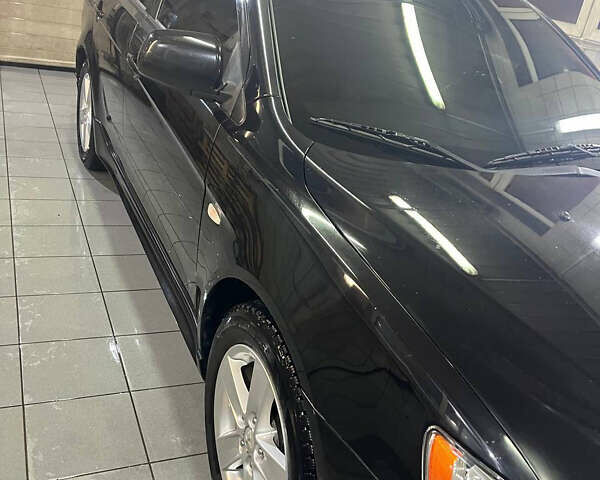 Черный Мицубиси Лансер, объемом двигателя 2 л и пробегом 200 тыс. км за 8000 $, фото 21 на Automoto.ua