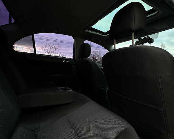 Черный Мицубиси Лансер, объемом двигателя 2 л и пробегом 236 тыс. км за 7950 $, фото 12 на Automoto.ua