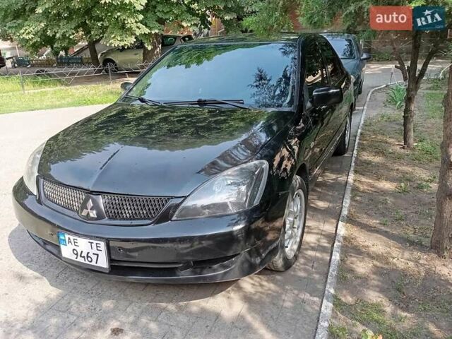 Черный Мицубиси Лансер, объемом двигателя 1.6 л и пробегом 445 тыс. км за 2999 $, фото 4 на Automoto.ua