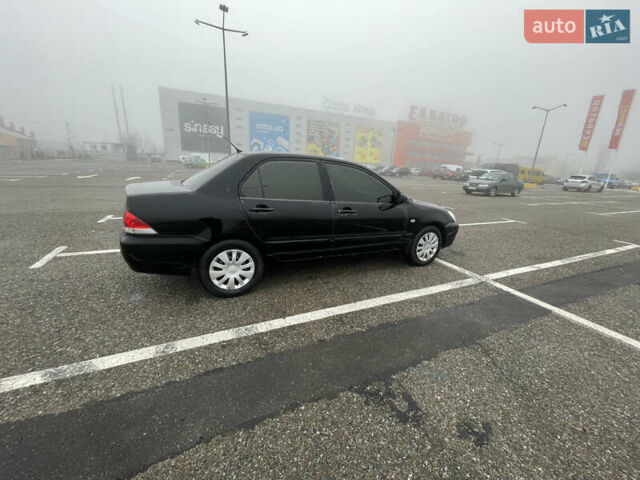 Черный Мицубиси Лансер, объемом двигателя 1.58 л и пробегом 214 тыс. км за 4400 $, фото 3 на Automoto.ua