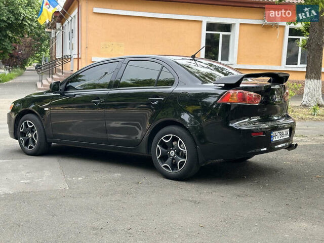 Черный Мицубиси Лансер, объемом двигателя 1.5 л и пробегом 195 тыс. км за 6500 $, фото 4 на Automoto.ua